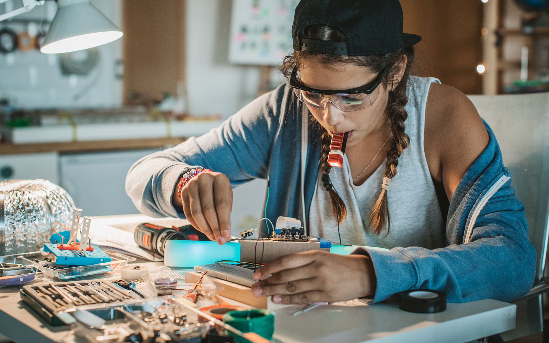 young girl working on electrical wiring project